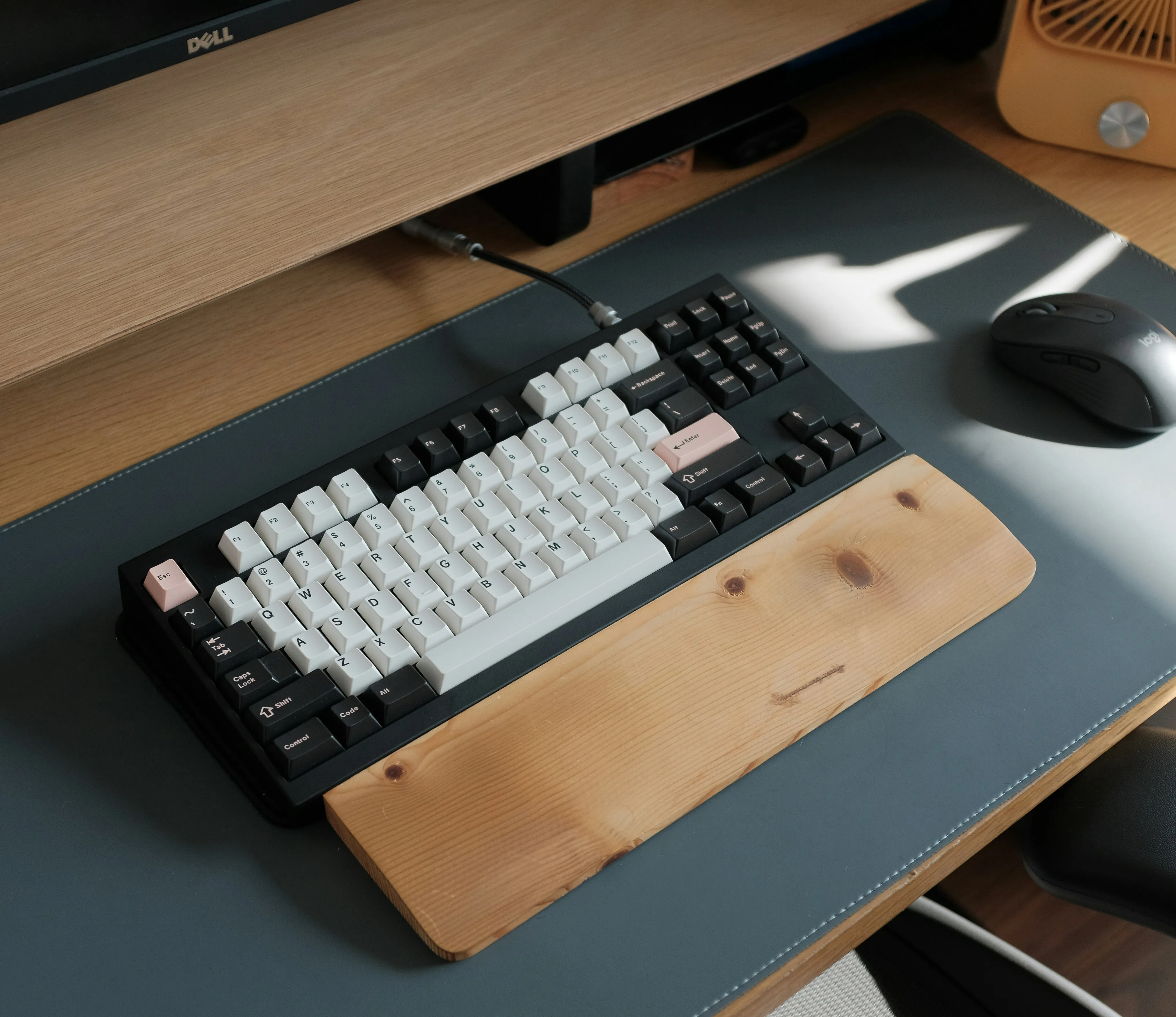 Design System Architecture - a computer keyboard sitting on top of a wooden desk